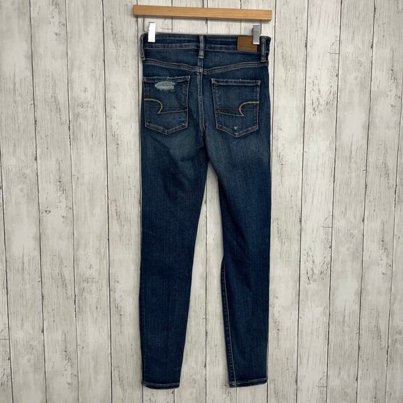 American Eagle Next Level Stretch Hi-Rise Dark Wash Button Distressed Jegging 4 - Picture 2 of 11